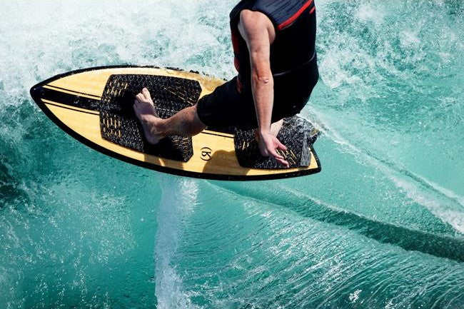 Wakesurfer riding the pocket of a boat wave